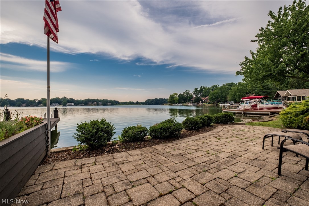 1415 Harbor Drive Northwest Canton, OH 44708 - Photo 43 of 46 View of patio / terrace with a boat dock and a water view