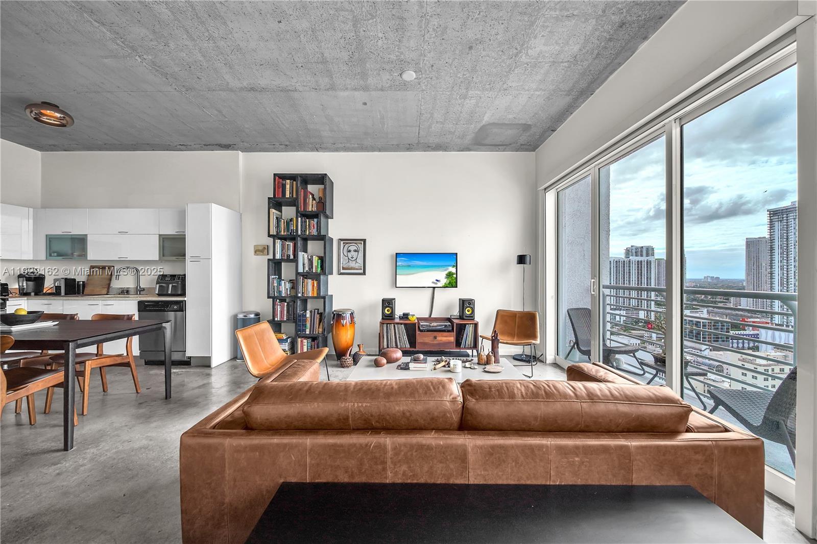 133 Northeast 2nd Avenue, Unit 2917 Miami, FL 33132 - Photo 4 of 13 a bedroom with furniture and large window