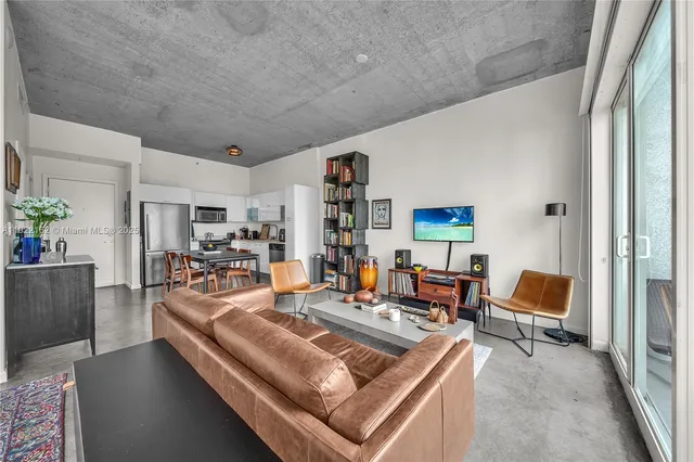 a living room with furniture and a chair