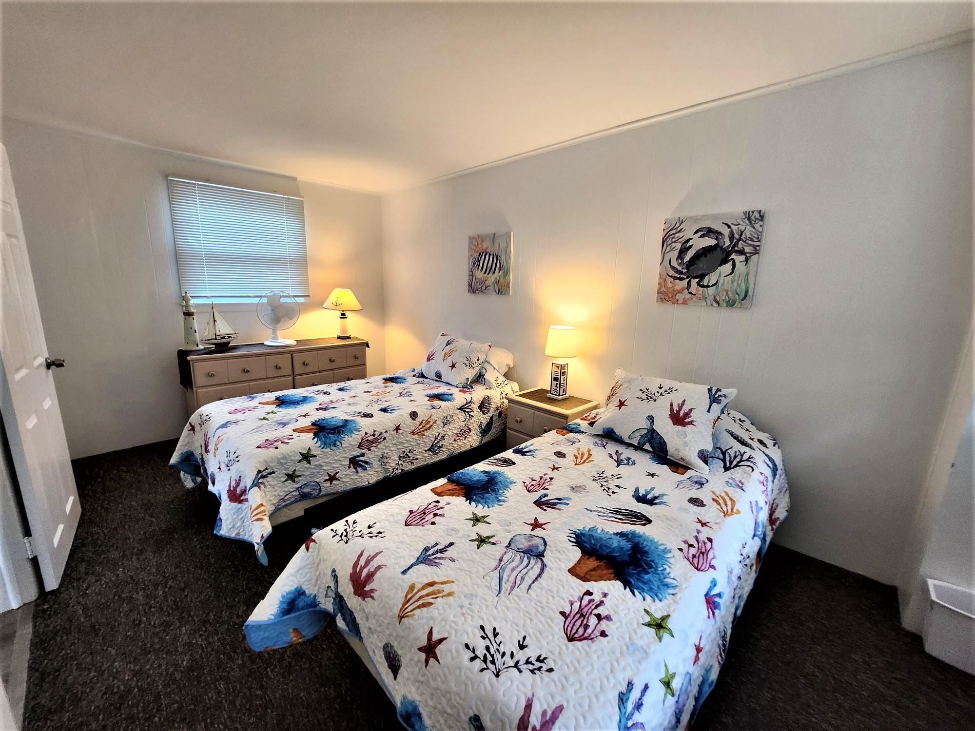 9903 2nd Stone Harbor, NJ 08247 - Photo 16 of 28 a bedroom with two beds and a window
