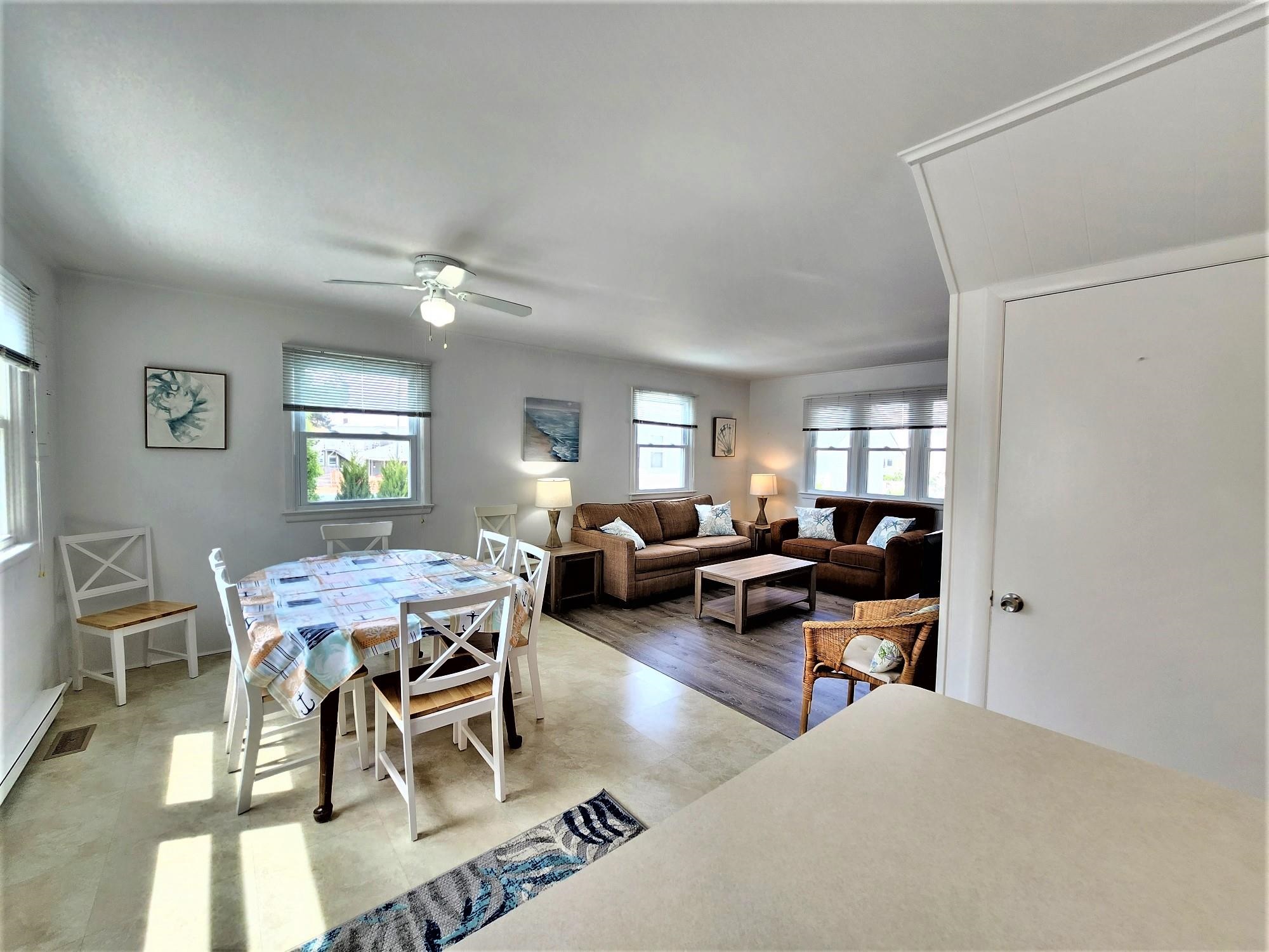 9903 2nd Stone Harbor, NJ 08247 - Photo 20 of 28 a living room with furniture a fireplace and a window