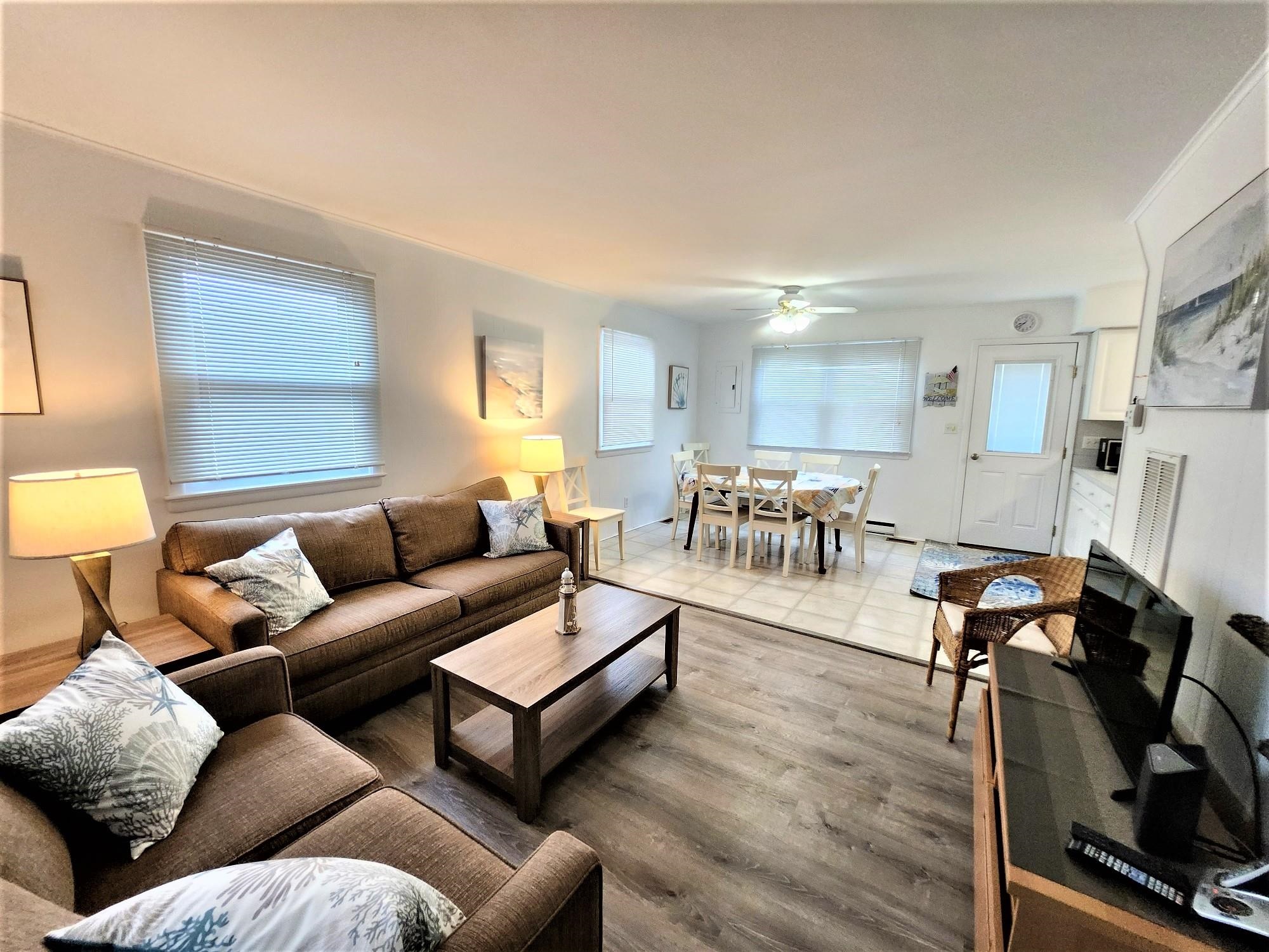 9903 2nd Stone Harbor, NJ 08247 - Photo 9 of 28 a living room with furniture and a wooden floor