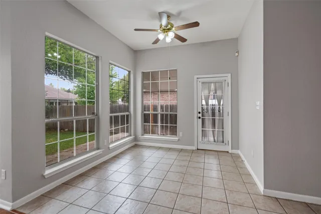 a view of empty room with windows