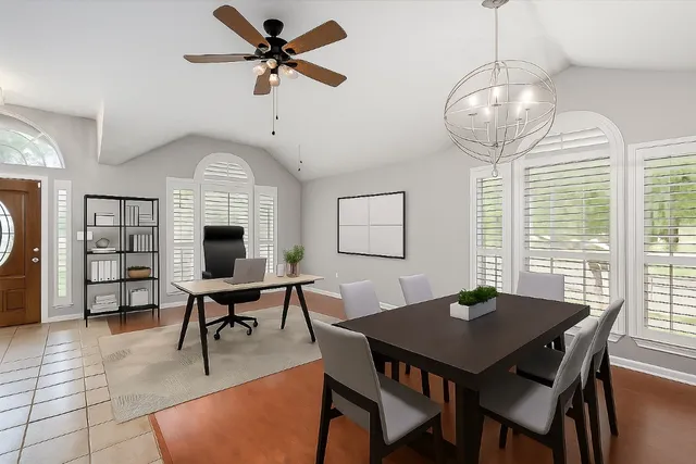 a view of a dining room with furniture window and wooden floor