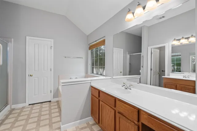 a bathroom with a sink a vanity and a mirror