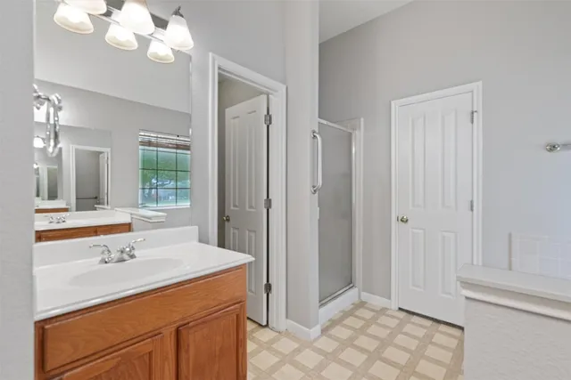 a bathroom with a sink vanity and mirror