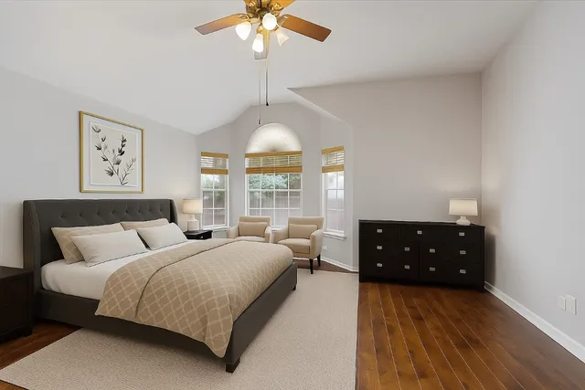 a bedroom with bed and window