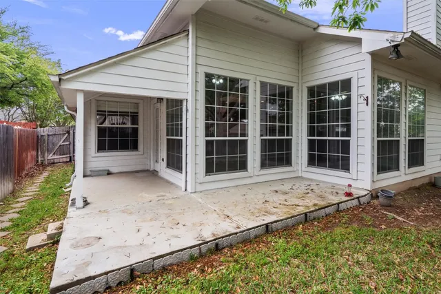 front view of a house with a large window