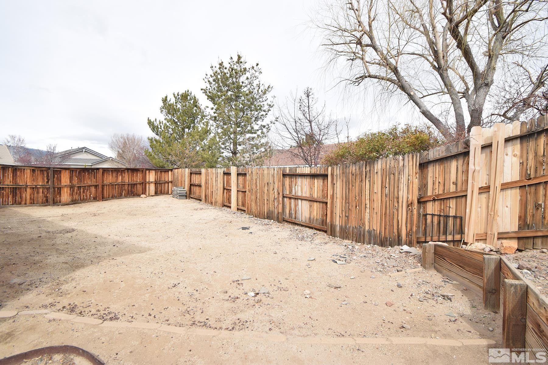 1650 Canyonlands Way Reno, NV 89521 - Photo 23 of 25 a view of a backyard of snow