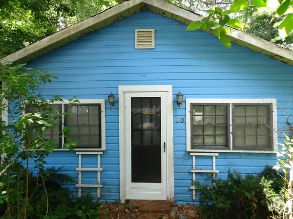 a view of a brick house with a large windows