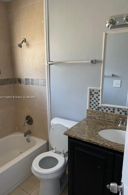 Avondale Pompano Beach, FL 33060 - Photo 11 of 18 a bathroom with a sink a toilet and bathtub
