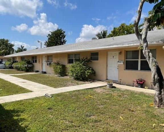 Avondale Pompano Beach, FL 33060 - Photo 13 of 18 a front view of house with yard
