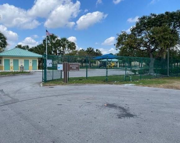 Avondale Pompano Beach, FL 33060 - Photo 18 of 18 a view of a house with a big yard and a large trees