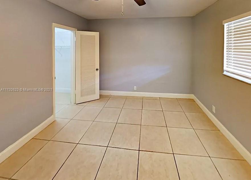 Avondale Pompano Beach, FL 33060 - Photo 8 of 18 a view of an empty room and window