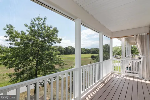 a view of a balcony with wooden floor