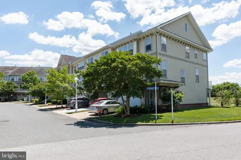 a front view of a building with a street
