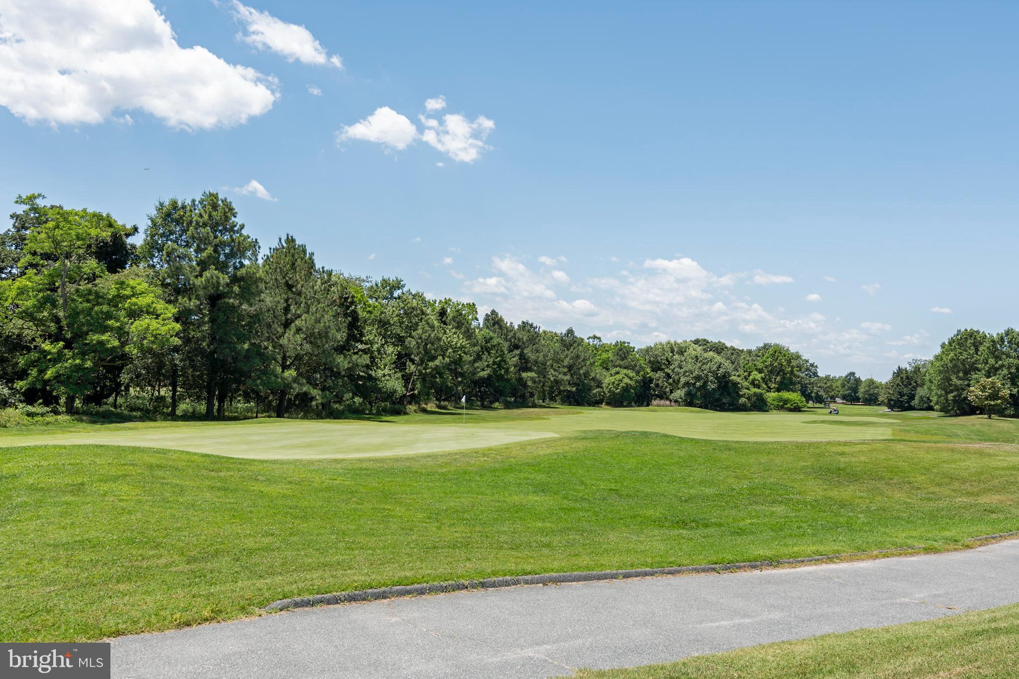 2804 Persimmon Place, Unit D3 Cambridge, MD 21613 - Photo 24 of 49 a view of a golf course with a lake