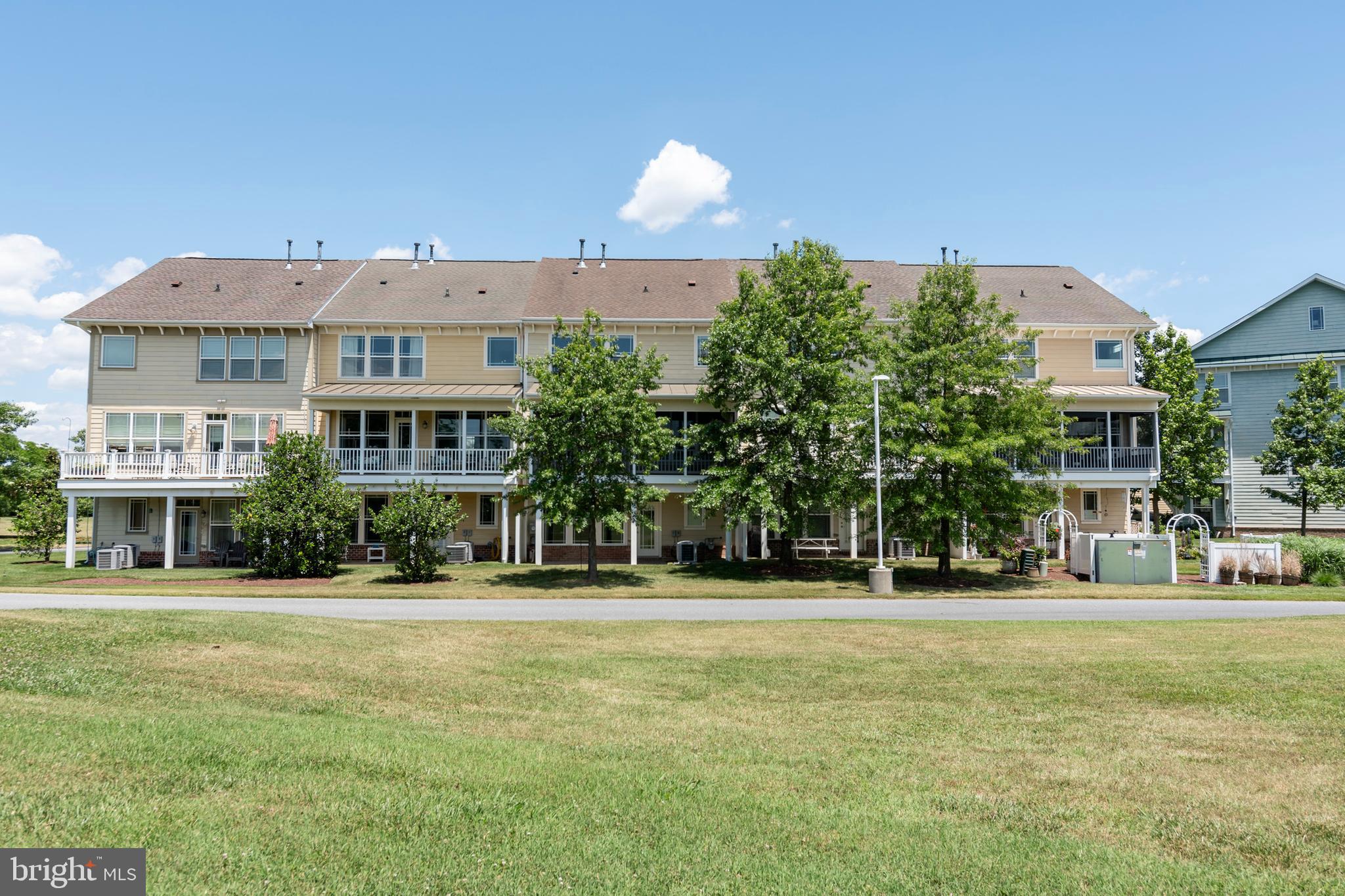 2804 Persimmon Place, Unit D3 Cambridge, MD 21613 - Photo 25 of 49 a front view of a building with a garden