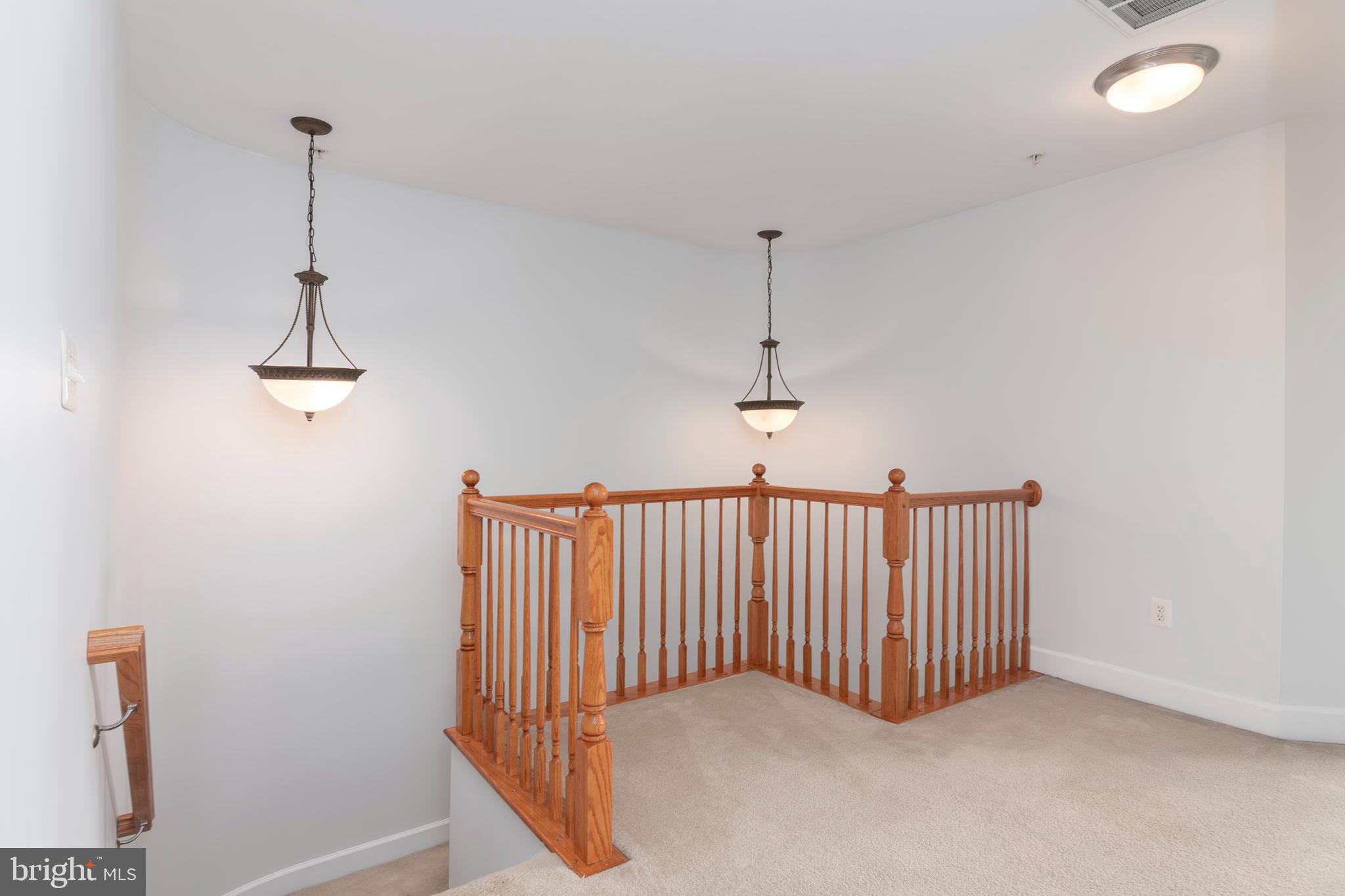 2804 Persimmon Place, Unit D3 Cambridge, MD 21613 - Photo 29 of 49 a view of a hallway with a window