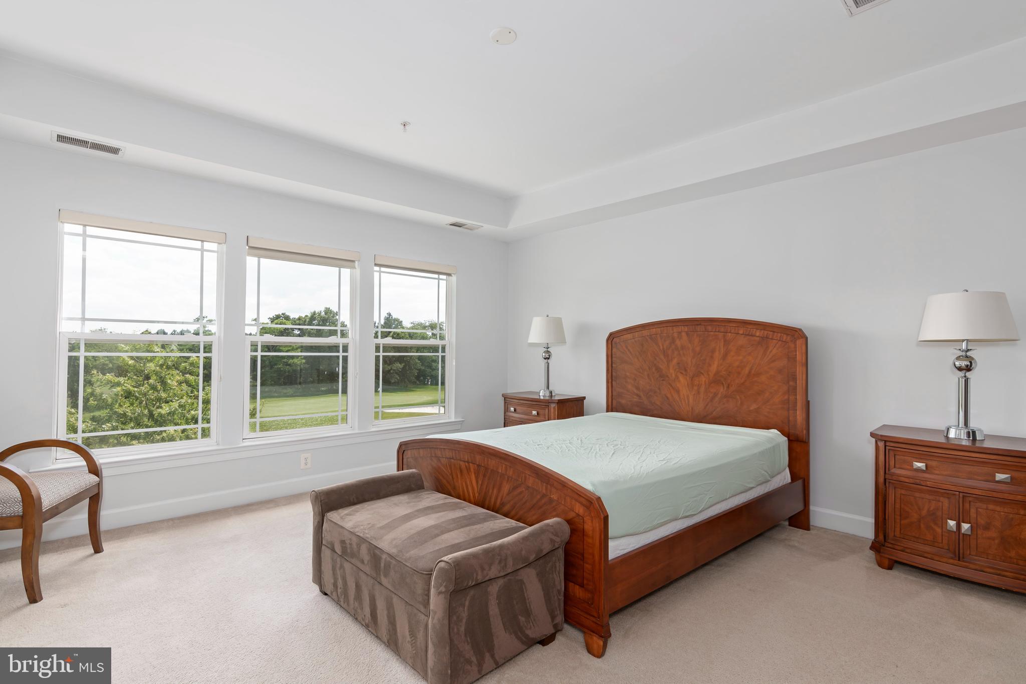 2804 Persimmon Place, Unit D3 Cambridge, MD 21613 - Photo 30 of 49 a bedroom with a bed and a large window