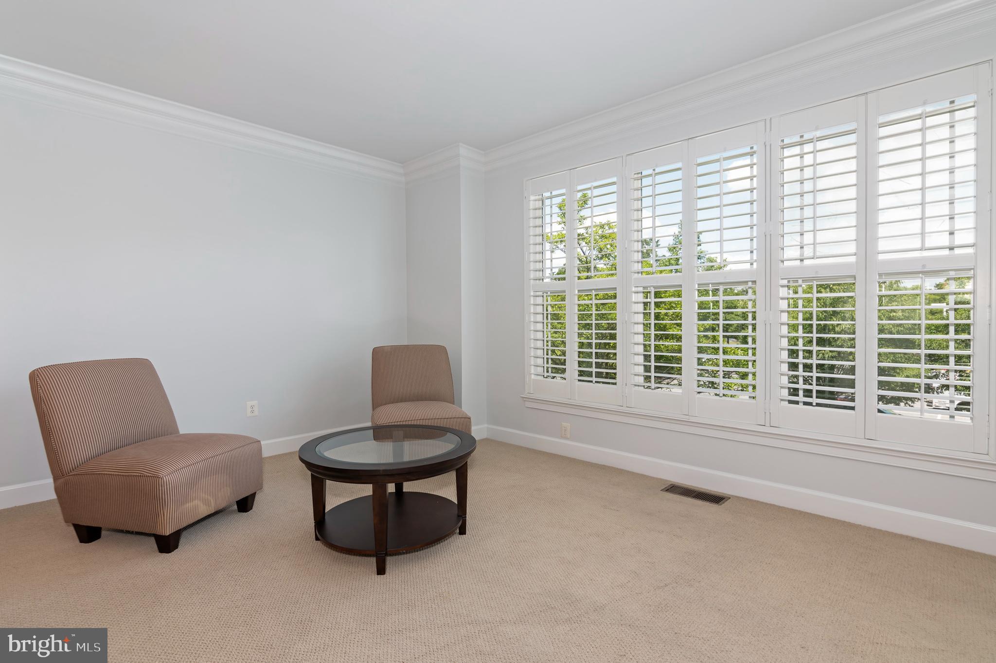 2804 Persimmon Place, Unit D3 Cambridge, MD 21613 - Photo 3 of 49 a living room with furniture and a window