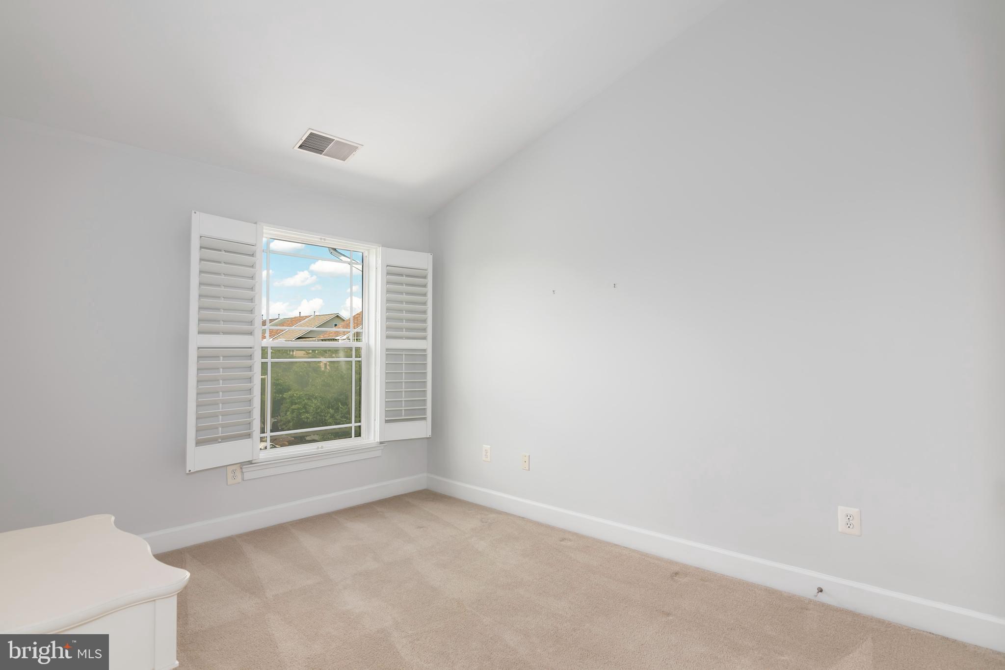 2804 Persimmon Place, Unit D3 Cambridge, MD 21613 - Photo 35 of 49 an empty room with a window