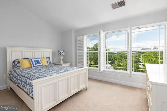 a bedroom with a bed and a table in it