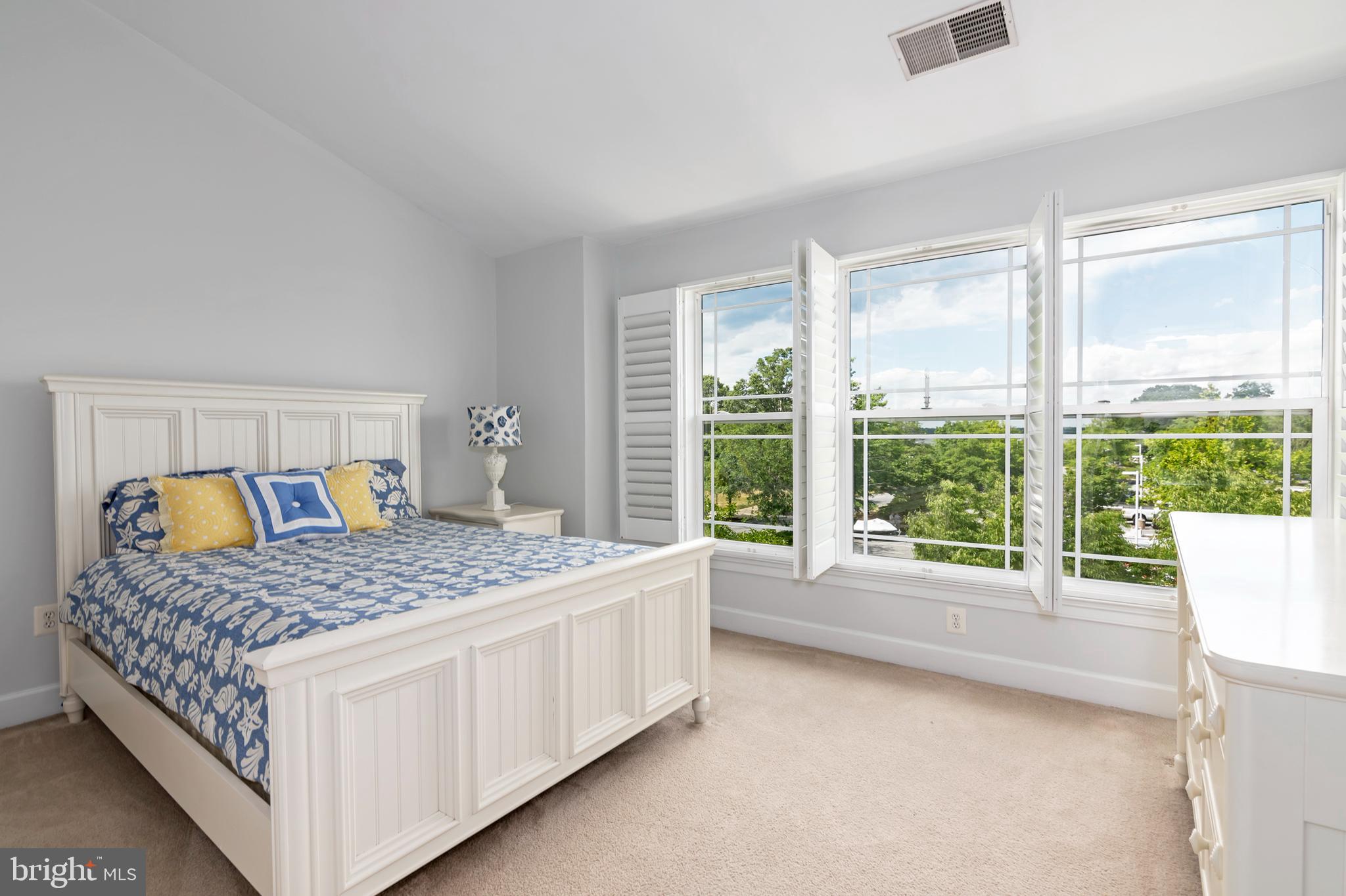 2804 Persimmon Place, Unit D3 Cambridge, MD 21613 - Photo 37 of 49 a bedroom with a bed and a large window with outer view