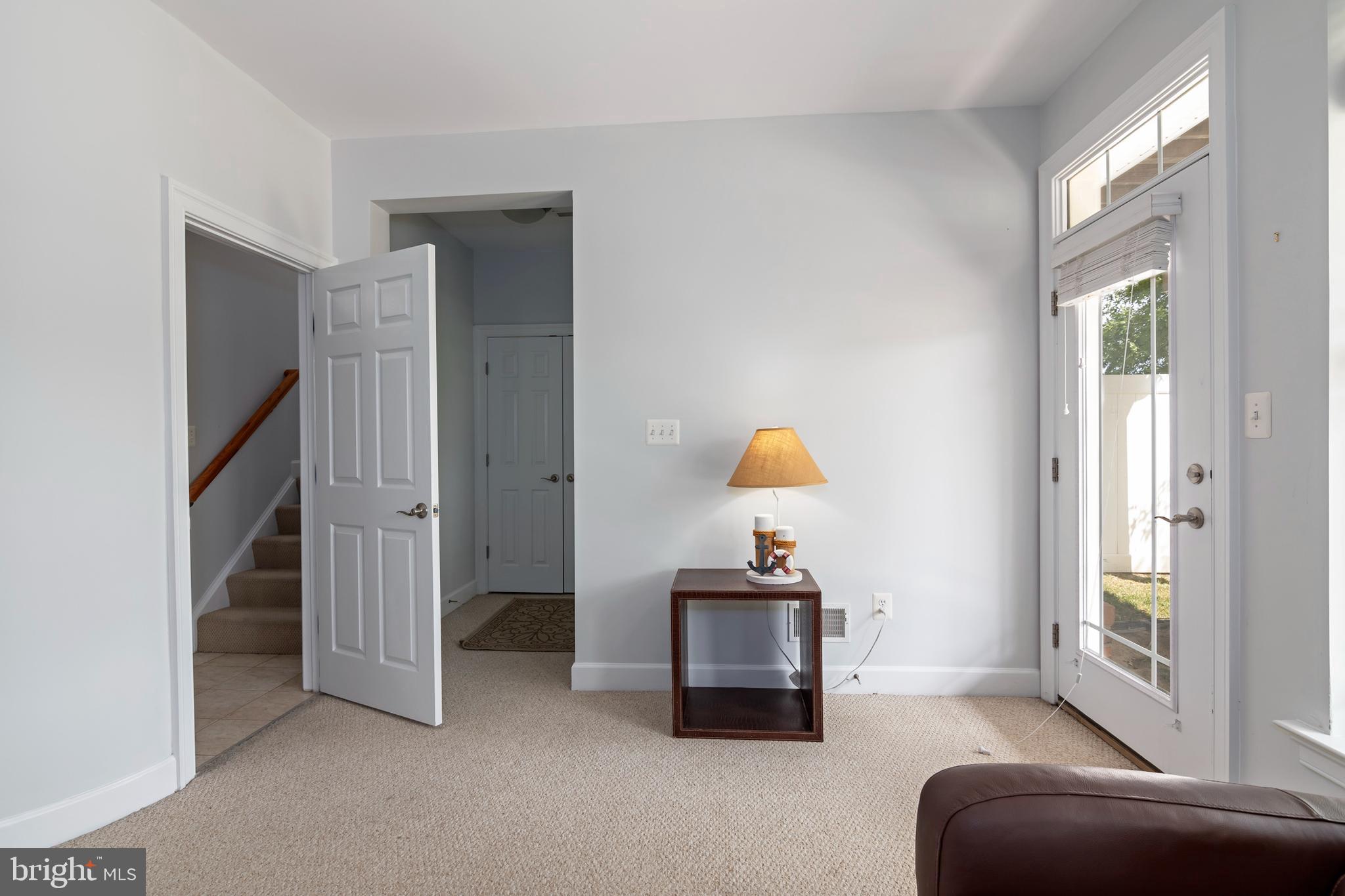 2804 Persimmon Place, Unit D3 Cambridge, MD 21613 - Photo 40 of 49 a living room with furniture and a window