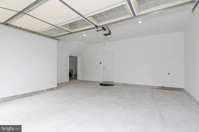 a picture of a bench in front of a wall