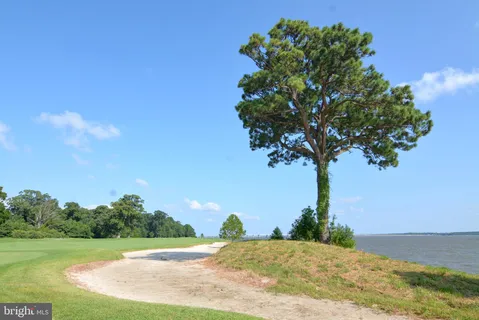 a picture of a bench in front of a wall