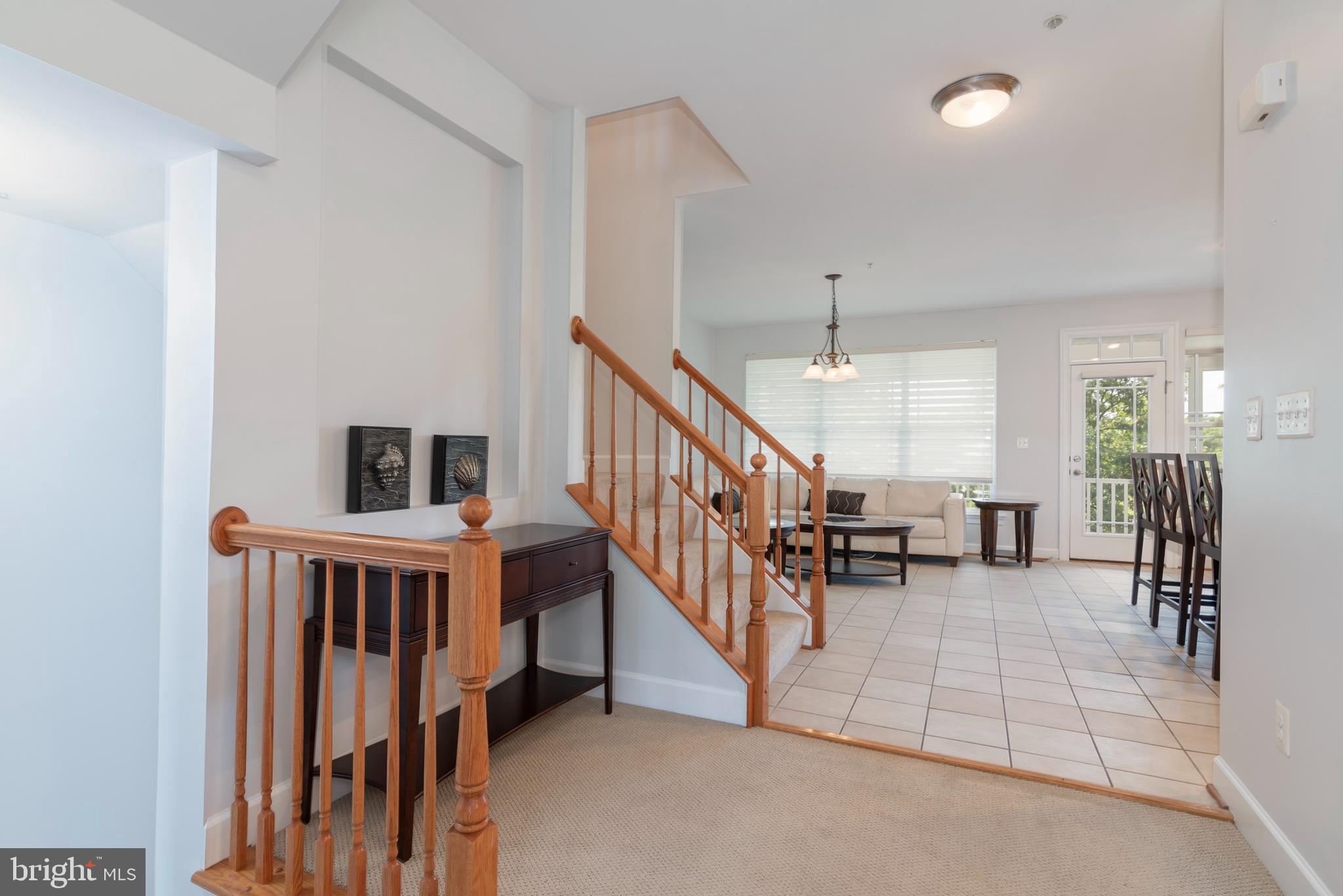 2804 Persimmon Place, Unit D3 Cambridge, MD 21613 - Photo 9 of 49 a view of livingroom with furniture and staircase