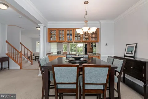 a kitchen with stainless steel appliances a refrigerator and a stove top oven
