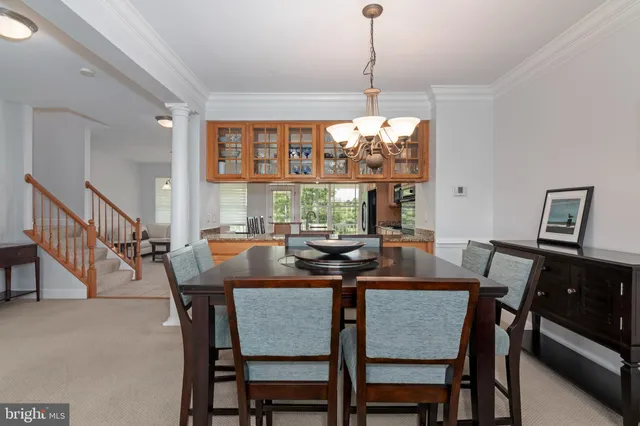 a kitchen with stainless steel appliances a refrigerator and a stove top oven