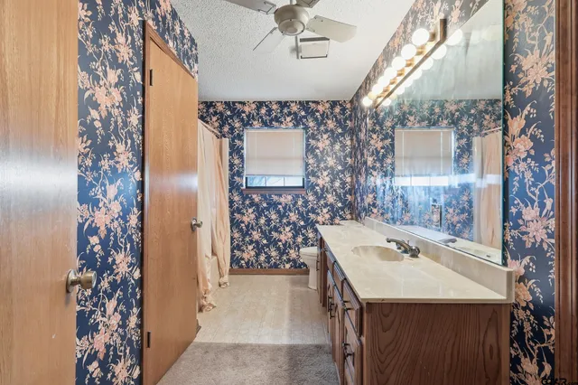 view of a bathroom with a sink and mirror