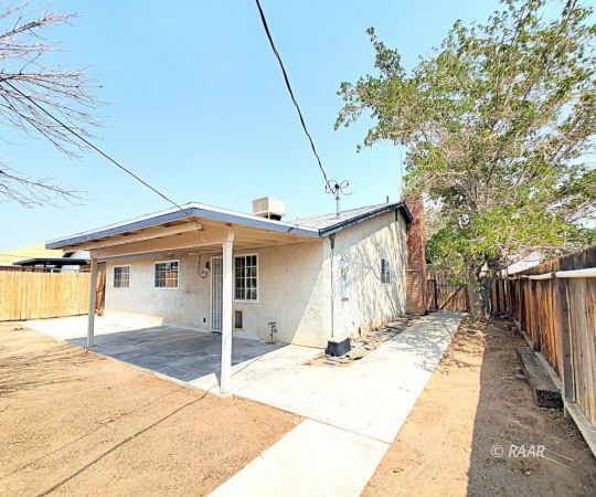 1037 South Ranger Street Ridgecrest, CA 93555 - Photo 22 of 26 a front view of a house with a garage