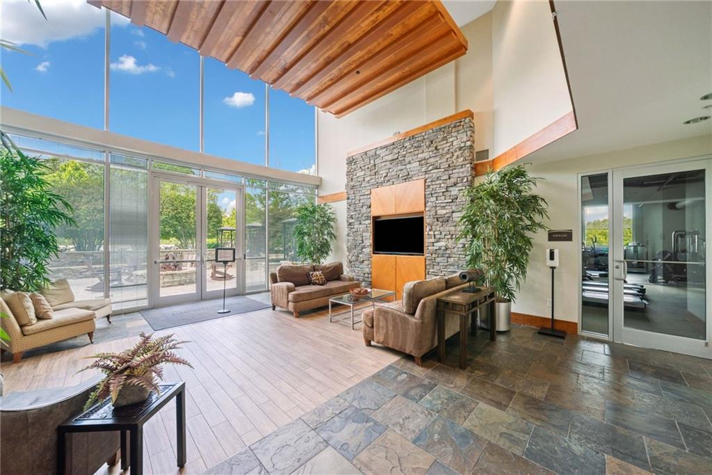 3300 Windy Ridge Parkway Southeast, Unit 621 Atlanta, GA 30339 - Photo 24 of 39 a outdoor space with patio the couches and a dining table with garden view