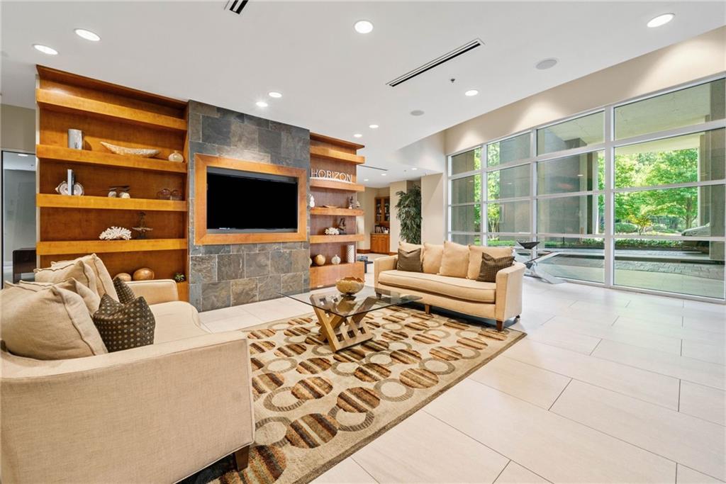 3300 Windy Ridge Parkway Southeast, Unit 621 Atlanta, GA 30339 - Photo 25 of 39 a living room with furniture and a flat screen tv