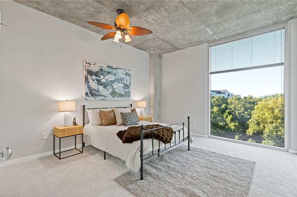 3300 Windy Ridge Parkway Southeast, Unit 621 Atlanta, GA 30339 - Photo 7 of 39 a living room with furniture and a large window