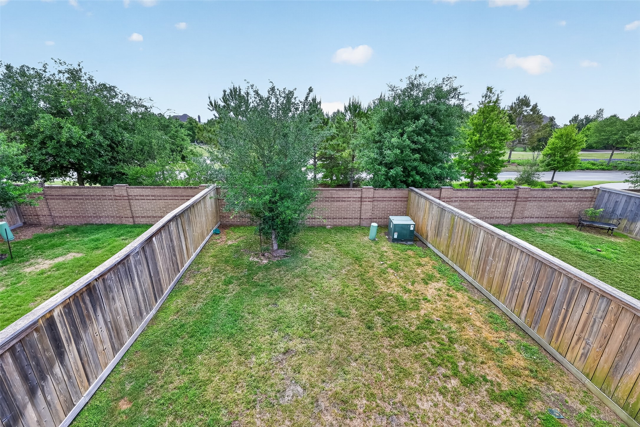 16226 Rattlesnake Run Trail Cypress, TX 77433 - Photo 17 of 37 Backyard with fenced space and open lawn