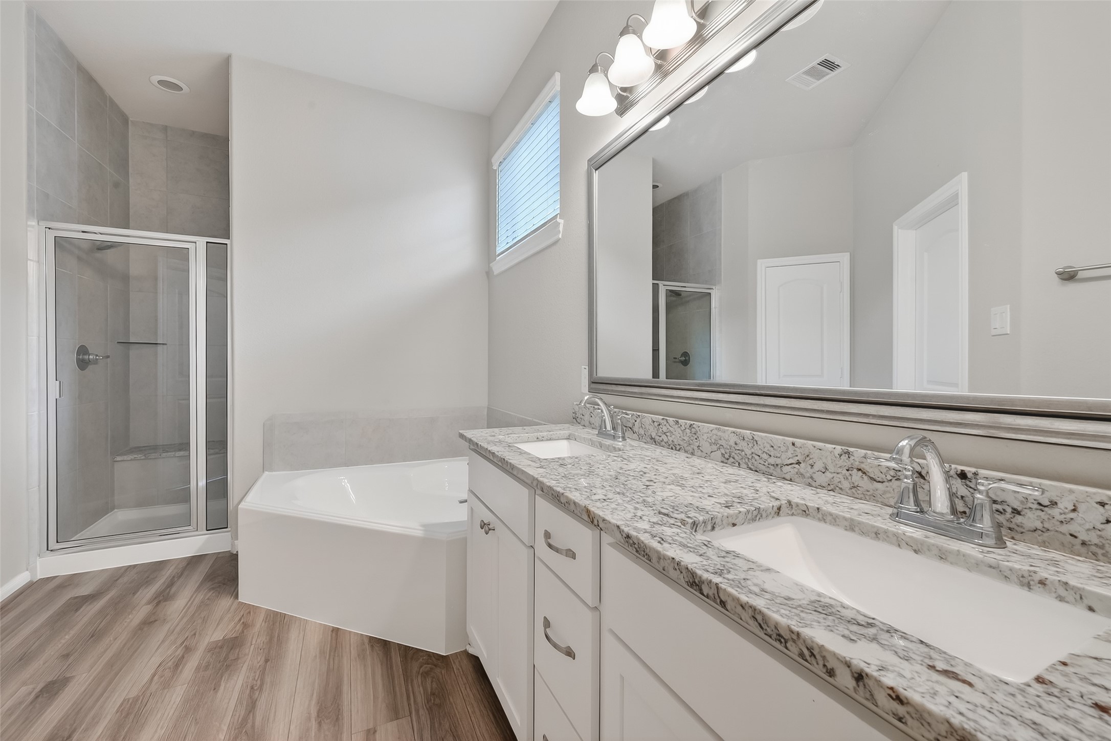 16226 Rattlesnake Run Trail Cypress, TX 77433 - Photo 23 of 37 Primary bath with dual sinks and updated finishes