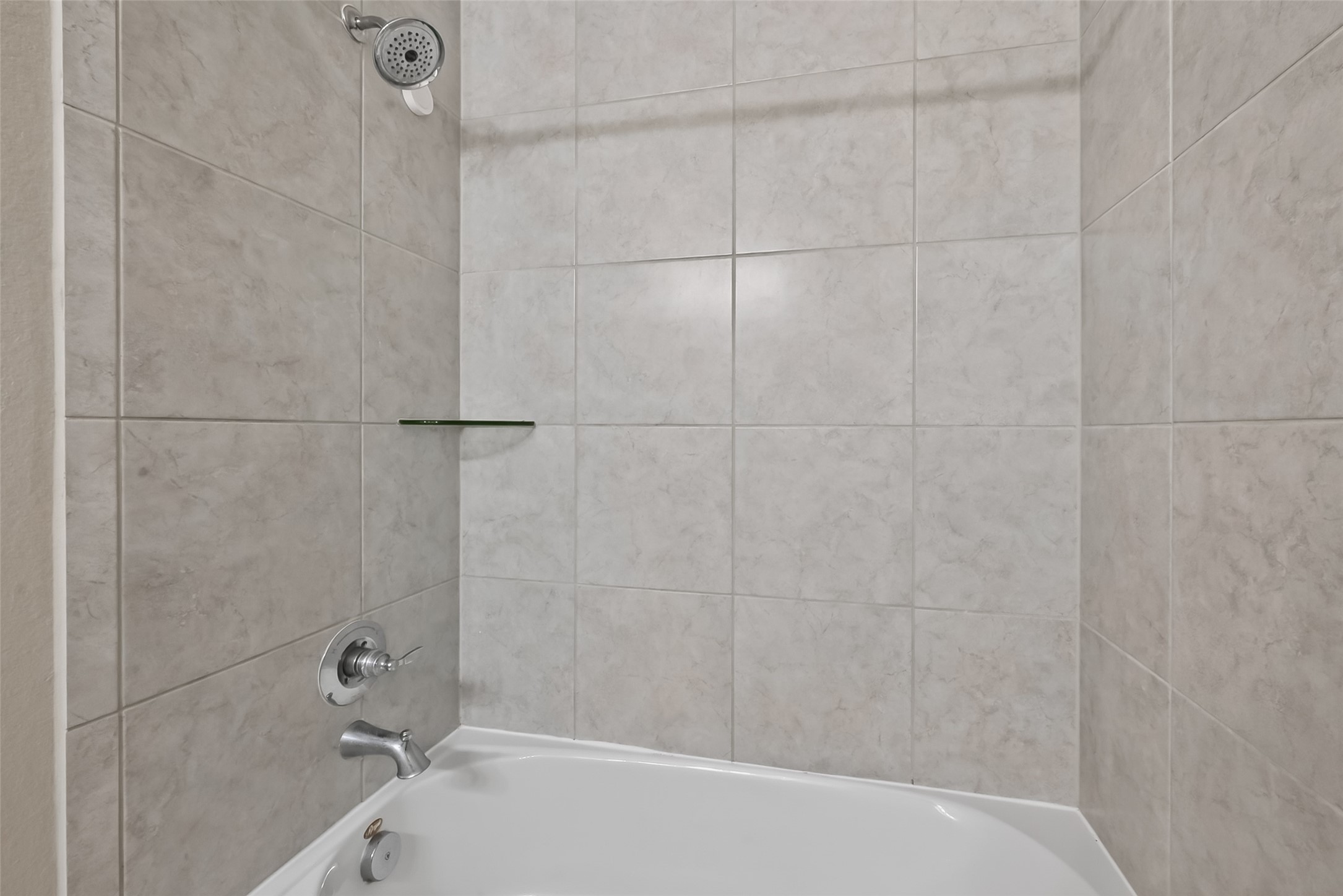 16226 Rattlesnake Run Trail Cypress, TX 77433 - Photo 31 of 37 Tub and shower combo with tile surround