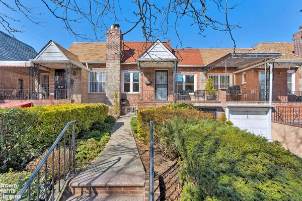 a front view of a house with swimming pool