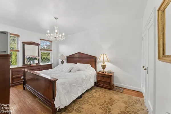 a bedroom with a bed and a chair