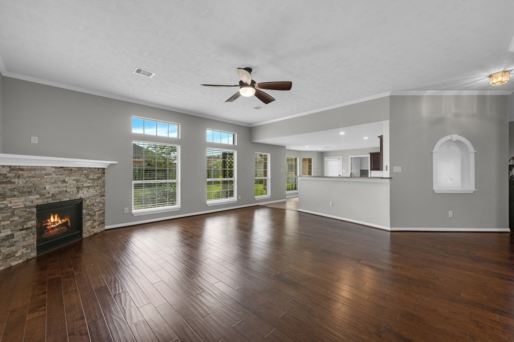 6606 Granbury Road Manvel, TX 77578 - Photo 14 of 48 Bright living area featuring large windows that fill the space with an abundance of natural light.