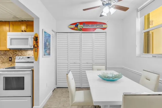 a view of a kitchen area with furniture and a window
