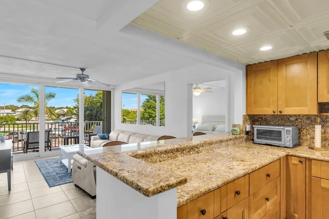 a kitchen with sink stove and cabinets