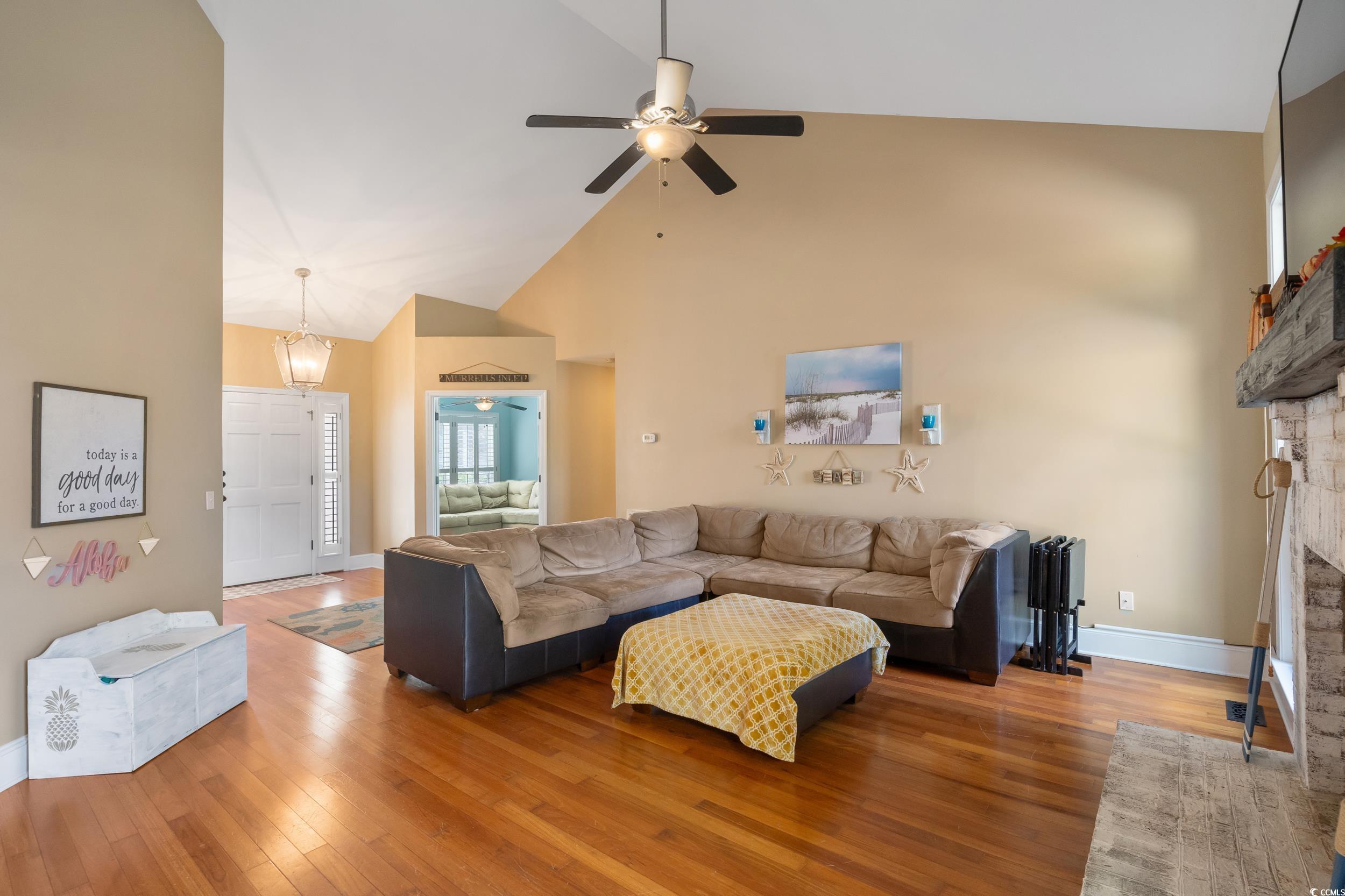 824 Mount Gilead Pl Drive Murrells Inlet, SC 29576 - Photo 11 of 40 Living room with a stone fireplace, high vaulted c