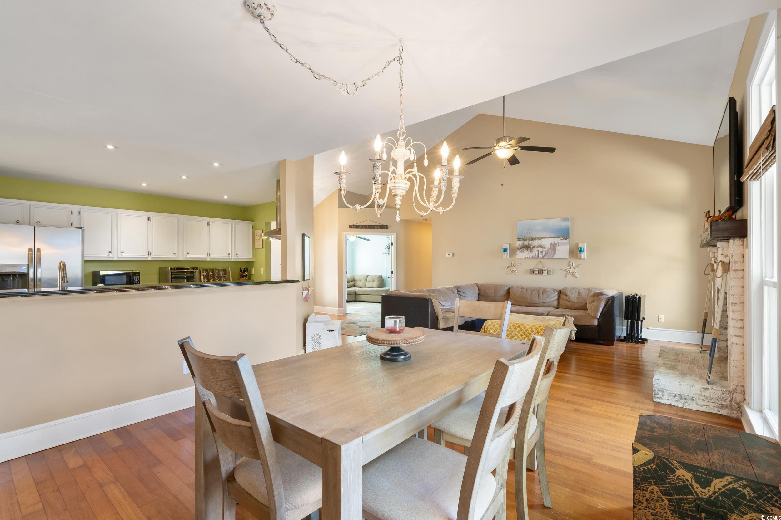 824 Mount Gilead Pl Drive Murrells Inlet, SC 29576 - Photo 12 of 40 Dining area with ceiling fan with notable chandeli
