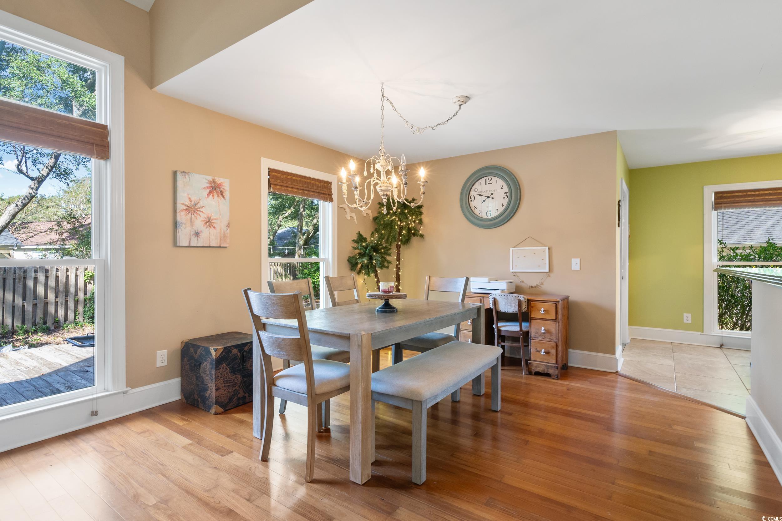 824 Mount Gilead Pl Drive Murrells Inlet, SC 29576 - Photo 13 of 40 Dining room featuring an inviting chandelier and l